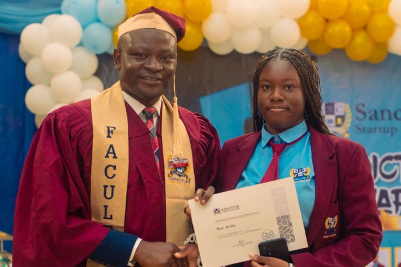 Principal presenting a Certificate of Excellence to a Sanctum Startup College student