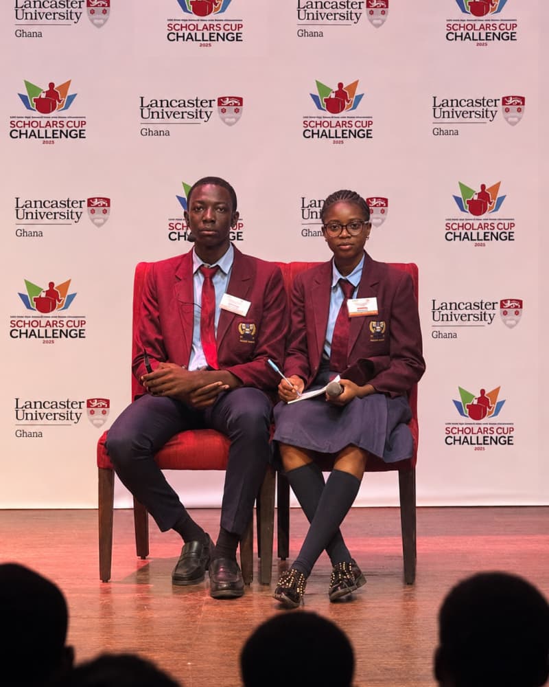 Sanctum Startup College students on stage at the Scholars Cup Challenge 2025 debate finale, Lancaster University Ghana